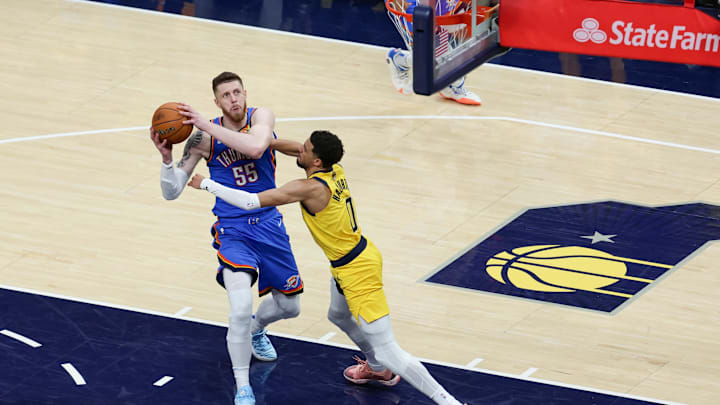 Jun 19, 2025; Indianapolis, Indiana, USA; Indiana Pacers guard Tyrese Haliburton (0) defends against Oklahoma City Thunder center Isaiah Hartenstein (55) in the third quarter during game six of the 2025 NBA Finals at Gainbridge Fieldhouse. Mandatory Credit: Trevor Ruszkowski-Imagn Images