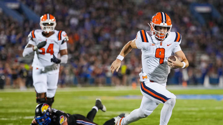 Sep 8, 2023; Lawrence, Kansas, USA; Illinois Fighting Illini quarterback Luke Altmyer (9) runs for a touchdown against the Kansas Jayhawks during the second half at David Booth Kansas Memorial Stadium. Mandatory Credit: Jay Biggerstaff-USA TODAY Sports