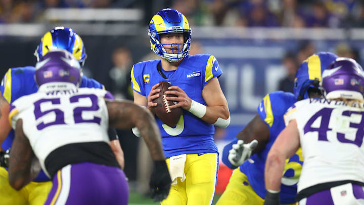 Jan 13, 2025; Glendale, AZ, USA; Los Angeles Rams quarterback Matthew Stafford (9) drops back to pass against the Minnesota Vikings during the second half in an NFC wild card game at State Farm Stadium. Mandatory Credit: Mark J. Rebilas-Imagn Images