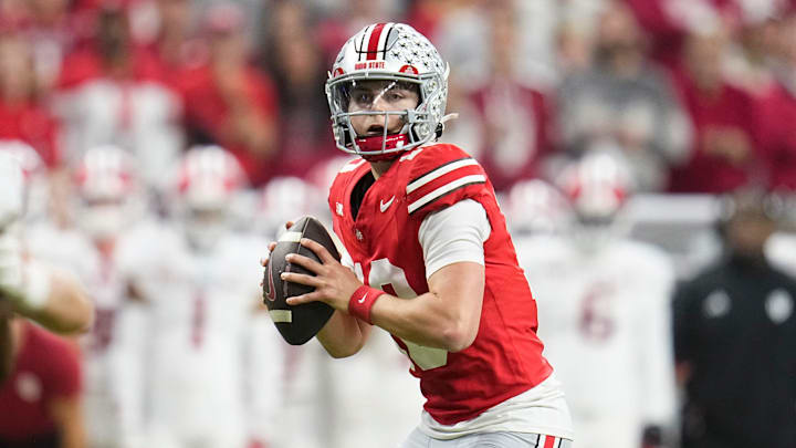 Ohio State Buckeyes quarterback Julian Sayin (10) drops back to pass during the first half of the Big Ten Conference championship game against the Indiana Hoosiers at Lucas Oil Stadium in Indianapolis on Dec. 6, 2025. Ohio State Buckeyes quarterback Julian Sayin (10) drops back to pass during the first half of the Big Ten Conference championship game against the Indiana Hoosiers at Lucas Oil Stadium in Indianapolis on Dec. 6, 2025.