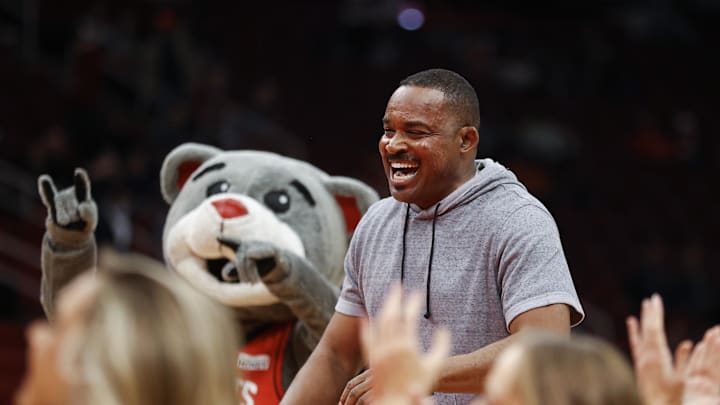 Mar 1, 2022; Houston, Texas, USA; Former NFL quarterback and 1989 Heisman Trophy winner Andre Ware reacts after attempting a ceremonial first shot before the game between the Houston Rockets and the Los Angeles Clippers at Toyota Center. Mandatory Credit: Troy Taormina-Imagn Images