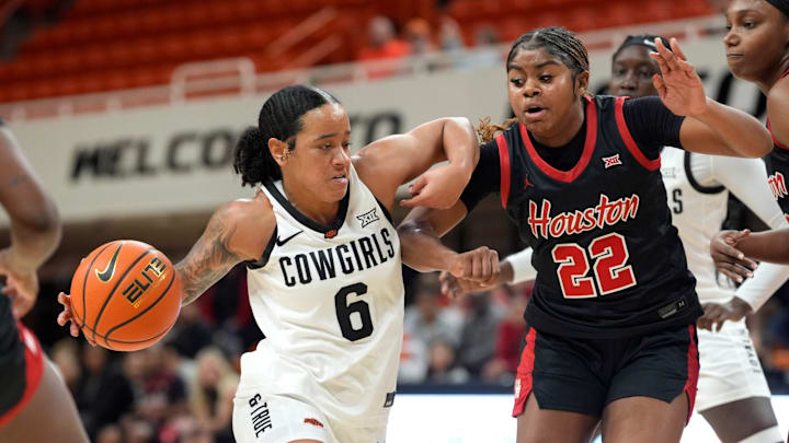 Oklahoma State Cowgirls guard Jadyn Wooten (6) dribbles beside Houston Cougars guard Kayla King (22) during a women's college basketball game between the Oklahoma State Cowgirls (OSU) and the Houston Cougars at Gallagher-Iba Arena in Stillwater, Saturday, Jan. 3, 2026. Oklahoma State won 83-52. Oklahoma State Cowgirls guard Jadyn Wooten (6) dribbles beside Houston Cougars guard Kayla King (22) during a women's college basketball game between the Oklahoma State Cowgirls (OSU) and the Houston Cougars at Gallagher-Iba Arena in Stillwater, Saturday, Jan. 3, 2026. Oklahoma State won 83-52.