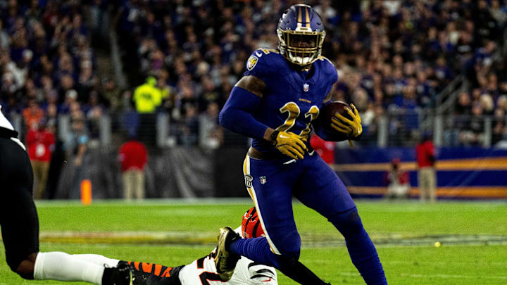 Baltimore Ravens running back Derrick Henry runs by Cincinnati Bengals safety Geno Stone. Baltimore Ravens running back Derrick Henry runs by Cincinnati Bengals safety Geno Stone.