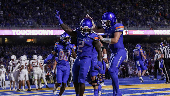 Sep 28, 2024; Boise, Idaho, USA; Boise State Broncos running back Ashton Jeanty (2) and quarterback Maddux Madsen (4) celebrate during the second quarter against the Washington State Cougars at Albertsons Stadium. Mandatory Credit: Brian Losness-Imagn Images