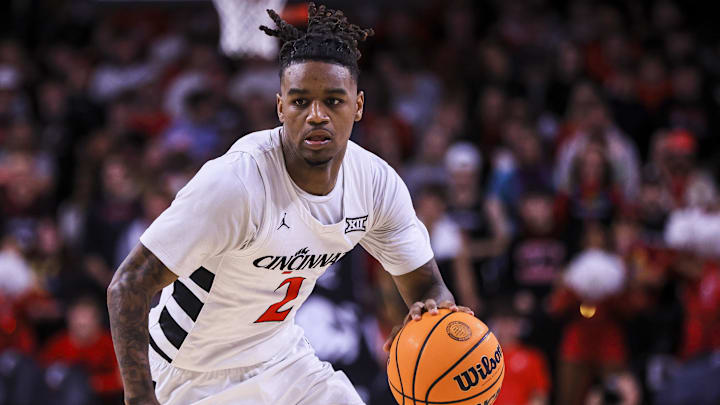 Feb 8, 2025; Cincinnati, Ohio, USA; Cincinnati Bearcats guard Jizzle James (2) dribbles against the Brigham Young Cougars in the first half at Fifth Third Arena. Mandatory Credit: Katie Stratman-Imagn Images
