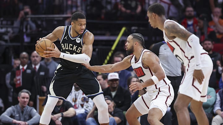 Feb 25, 2025; Houston, Texas, USA; Milwaukee Bucks forward Giannis Antetokounmpo (34) controls the ball as Houston Rockets forward Dillon Brooks (9) defends during the second quarter at Toyota Center. Mandatory Credit: Troy Taormina-Imagn Images