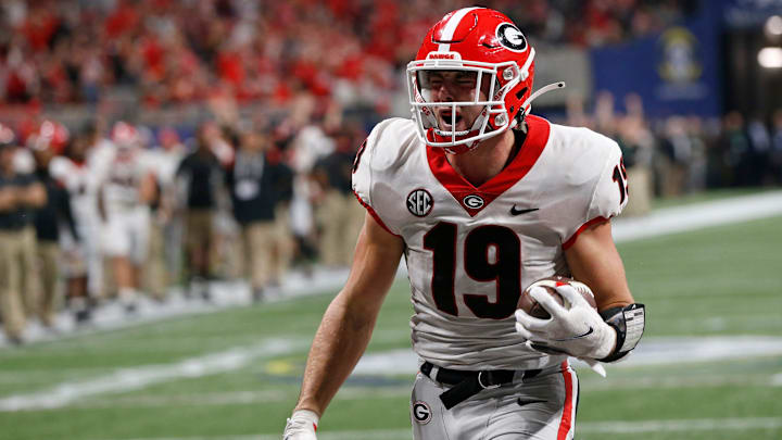 Georgia tight end Brock Bowers (19) celebrates after scoring a touchdown during the second half of the Southeastern Conference championship NCAA college football game between Georgia and Alabama in Atlanta, on Saturday, Dec. 4, 2021. Alabama won 41-24.

News Joshua L Jones