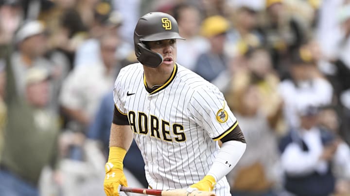 May 28, 2025; San Diego, California, USA; San Diego Padres first baseman Gavin Sheets (30) watches the flight of his two-run home run during the seventh inning against the Miami Marlins at Petco Park. Mandatory Credit: Denis Poroy-Imagn Images