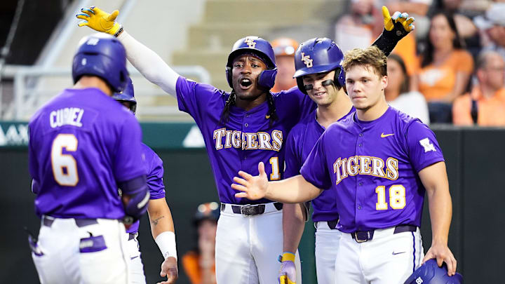 LSU teammates wait at home to celebrate with LSU's Derek Curiel (6) after Curiel hit a grand slam during a college baseball game between Tennessee and LSU at Lindsey Nelson Stadium in Knoxville, Tennessee., on April 3, 2026.