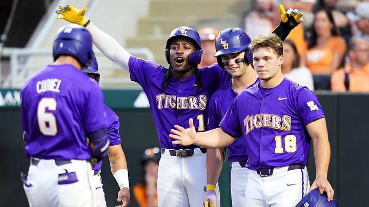 LSU teammates wait at home to celebrate with LSU's Derek Curiel (6) after Curiel hit a grand slam during a college baseball game between Tennessee and LSU at Lindsey Nelson Stadium in Knoxville, Tennessee., on April 3, 2026.