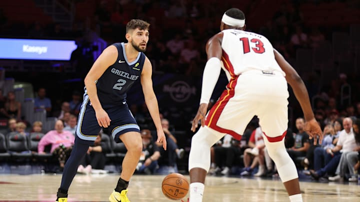 Oct,17, 2025; Miami, Florida, USA; Grizzlies guard Ty Jerome (2) being defended by Bam Adebayo (13) during the Grizzlies' preseason game against the Miami Heat. 