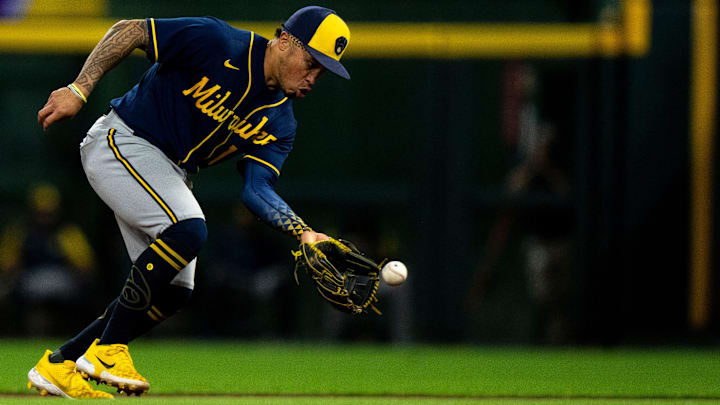 Milwaukee Brewers second baseman Kolten Wong (16) fields a ground ball hit by Cincinnati Reds