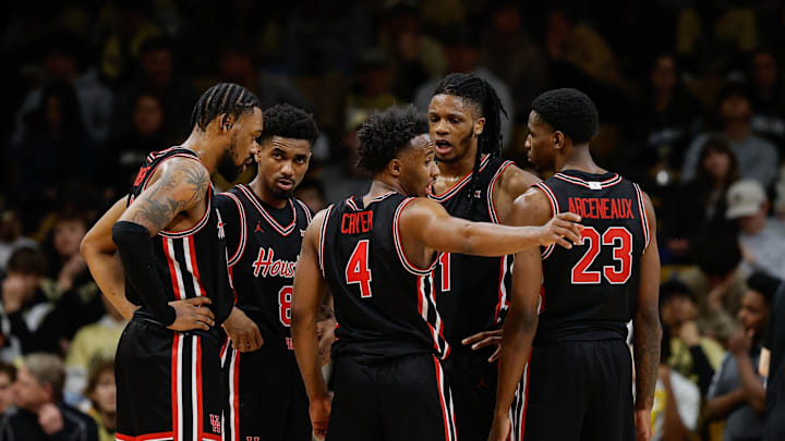 Feb 8, 2025; Boulder, Colorado, USA; Houston Cougars guard L.J. Cryer (4) talks with forward Joseph Tugler (11) and guard Mylik Wilson (8) and forward J'Wan Roberts (13) and guard Terrance Arceneaux (23) in the second half against the Colorado Buffaloes at CU Events Center. Mandatory Credit: Isaiah J. Downing-Imagn Images