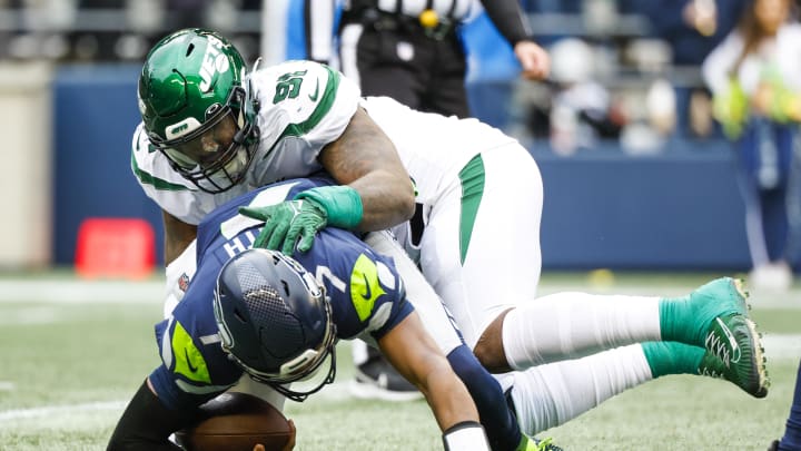 Jan 1, 2023; Seattle, Washington, USA; New York Jets defensive end John Franklin-Myers (91) sacks Jan 1, 2023; Seattle, Washington, USA; New York Jets defensive end John Franklin-Myers (91) sacks