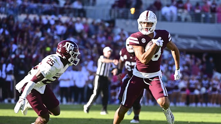 Mississippi State Bulldogs tight end Seydou Traore (18) runs the ball after a reception against Texas A&M Aggies defensive back Dalton Brooks (25) during the second quarter at Davis Wade Stadium at Scott Field.