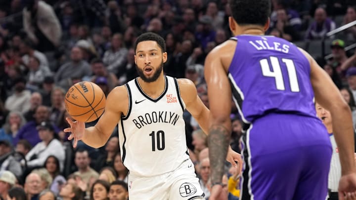 Nov 24, 2024; Sacramento, California, USA; Brooklyn Nets guard Ben Simmons (10) dribbles against Sacramento Kings forward Trey Lyles (41) during the second quarter at Golden 1 Center. Mandatory Credit: Darren Yamashita-Imagn Images