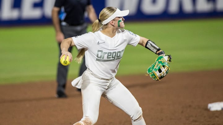 May 30, 2025; Oklahoma City, OK, USA;  Oregon Ducks infielder Paige Sinicki (38) throws to first base in the second inning against the Ole Miss Rebels during the NCAA Softball Women's College World Series at Devon Park. Mandatory Credit: Brett Rojo-Imagn Images