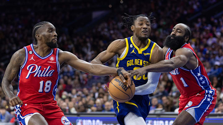Dec 16, 2022; Philadelphia, Pennsylvania, USA; Philadelphia 76ers guard James Harden (1) and guard Shake Milton (18) steal the ball from Golden State Warriors forward Jonathan Kuminga (00) during the second quarter at Wells Fargo Center. Mandatory Credit: Bill Streicher-Imagn Images