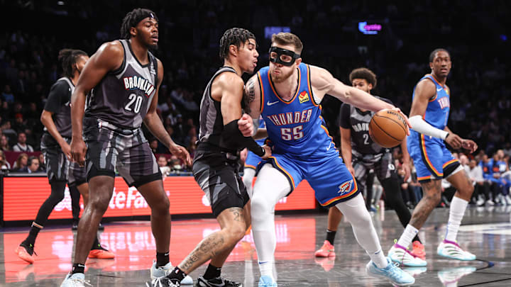 Feb 26, 2025; Brooklyn, New York, USA; Oklahoma City Thunder center Isaiah Hartenstein (55) looks to drive past Brooklyn Nets guard Killian Hayes (7) in the first quarter at Barclays Center. Mandatory Credit: Wendell Cruz-Imagn Images Feb 26, 2025; Brooklyn, New York, USA; Oklahoma City Thunder center Isaiah Hartenstein (55) looks to drive past Brooklyn Nets guard Killian Hayes (7) in the first quarter at Barclays Center. Mandatory Credit: Wendell Cruz-Imagn Images