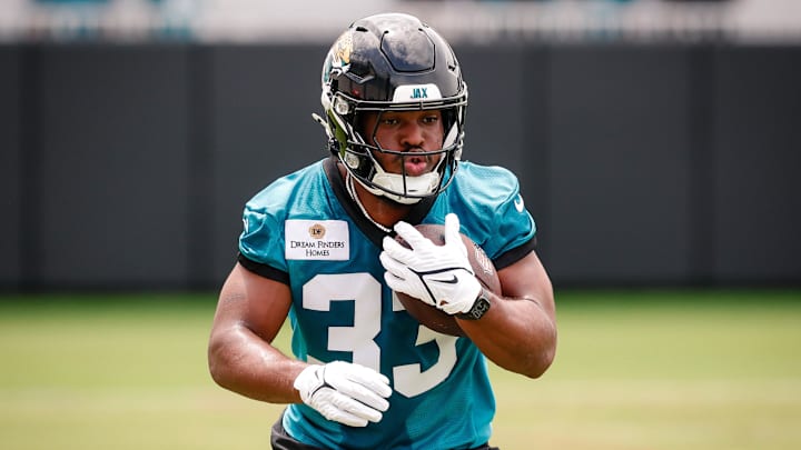 May 10, 2025; Jacksonville, FL, USA; Jacksonville Jaguars running back Bhayshul Tuten (33) participates in a drill during rookie minicamp at Miller Electric Center. Mandatory Credit: Travis Register-Imagn Images May 10, 2025; Jacksonville, FL, USA; Jacksonville Jaguars running back Bhayshul Tuten (33) participates in a drill during rookie minicamp at Miller Electric Center. Mandatory Credit: Travis Register-Imagn Images