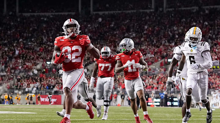 Sep 7, 2024; Columbus, Ohio, USA; Ohio State Buckeyes running back TreVeyon Henderson (32) runs for a touchdown during the second half of the NCAA football game against the Western Michigan Broncos at Ohio Stadium.