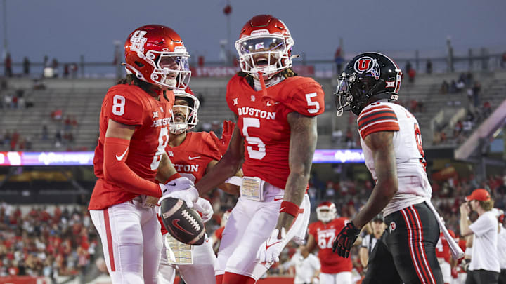 Oct 26, 2024; Houston, Texas, USA; Houston Cougars wide receiver Stephon Johnson (5) celebrates after a touchdown reception during the second quarter against the Utah Utes at TDECU Stadium. Mandatory Credit: Troy Taormina-Imagn Images