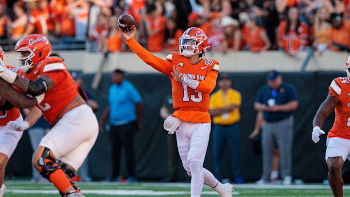 Oct 5, 2024; Stillwater, Oklahoma, USA; Oklahoma State Cowboys quarterback Garret Rangel (13) throws a pass against the West Virginia Mountaineers during the fourth quarter at Boone Pickens Stadium. Mandatory Credit: William Purnell-Imagn Images Oct 5, 2024; Stillwater, Oklahoma, USA; Oklahoma State Cowboys quarterback Garret Rangel (13) throws a pass against the West Virginia Mountaineers during the fourth quarter at Boone Pickens Stadium. Mandatory Credit: William Purnell-Imagn Images