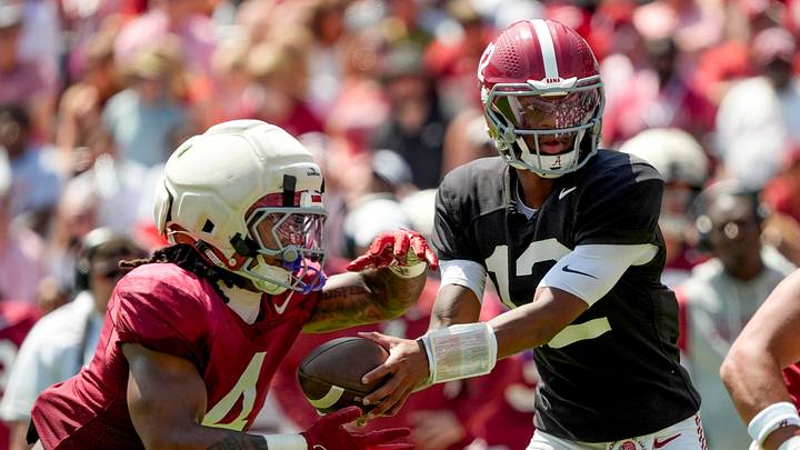 April 11, 2026; Tuscaloosa, AL, USA; Alabama quarterback Keelon Russell hands off to running back Daniel Hill at Bryant-Denny Stadium during the Alabama A Day scrimmage.