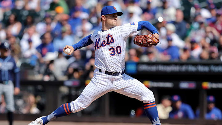 May 18, 2023; New York City, New York, USA; New York Mets relief pitcher David Robertson (30) pitches against the Tampa Bay Rays during the ninth inning at Citi Field. Mandatory Credit: Brad Penner-Imagn Images May 18, 2023; New York City, New York, USA; New York Mets relief pitcher David Robertson (30) pitches against the Tampa Bay Rays during the ninth inning at Citi Field. Mandatory Credit: Brad Penner-Imagn Images