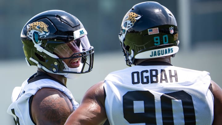 Jacksonville Jaguars defensive end Travon Walker (44) talks with Jacksonville Jaguars defensive lineman Emmanuel Ogbah (90) during the fourth organized team activity at the Miller Electric Center in Jacksonville, Fla. Tuesday, May 27, 2025. [Doug Engle/Florida Times-Union]