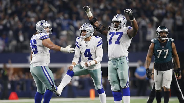 Dallas Cowboys Dak Prescott and Tyron Smith celebrate a touchdown against the Philadelphia Eagles.