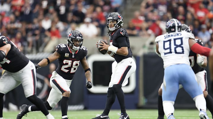 Nov 24, 2024; Houston, Texas, USA; Houston Texans quarterback C.J. Stroud (7) drops back to pass against the Tennessee Titans in the fourth quarter at NRG Stadium. Mandatory Credit: Thomas Shea-Imagn Images
