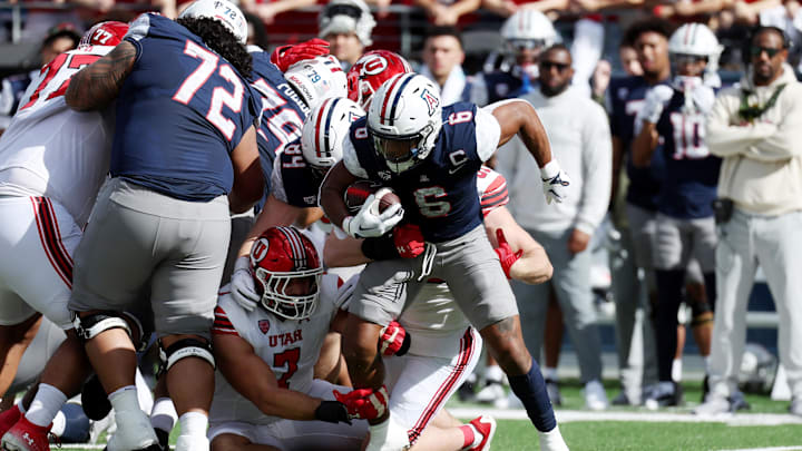 Nov 18, 2023; Tucson, Arizona, USA; Arizona Wildcats running back Michael Wiley (6) runs the ball against the Utah Utes during the second half at Arizona Stadium. Mandatory Credit: Zachary BonDurant-Imagn Images