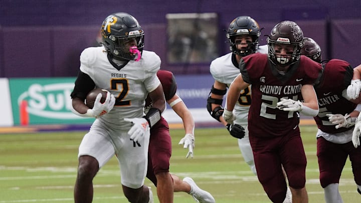 Regina's running back Savion Miller (2) runs with the ball for a first down against Grundy Center during the first quarter in the 1A High School state semi-final on Nov. 14, 2025, at UNI-Dome in Cedar Falls, Iowa.
