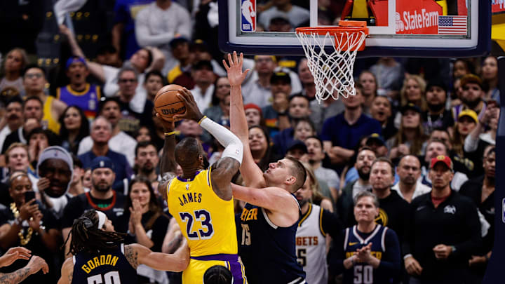 Apr 29, 2024; Denver, Colorado, USA; Los Angeles Lakers forward LeBron James (23) drives to the net against Denver Nuggets center Nikola Jokic (15) in the fourth quarter during game five of the first round for the 2024 NBA playoffs at Ball Arena. Mandatory Credit: Isaiah J. Downing-Imagn Images Apr 29, 2024; Denver, Colorado, USA; Los Angeles Lakers forward LeBron James (23) drives to the net against Denver Nuggets center Nikola Jokic (15) in the fourth quarter during game five of the first round for the 2024 NBA playoffs at Ball Arena. Mandatory Credit: Isaiah J. Downing-Imagn Images