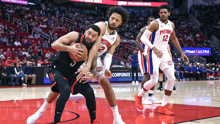 Jan 20, 2025; Houston, Texas, USA; Houston Rockets guard Fred VanVleet (5) is defended by Detroit Pistons guard Cade Cunningham (2) in the first quarter at Toyota Center. Mandatory Credit: Thomas Shea-Imagn Images