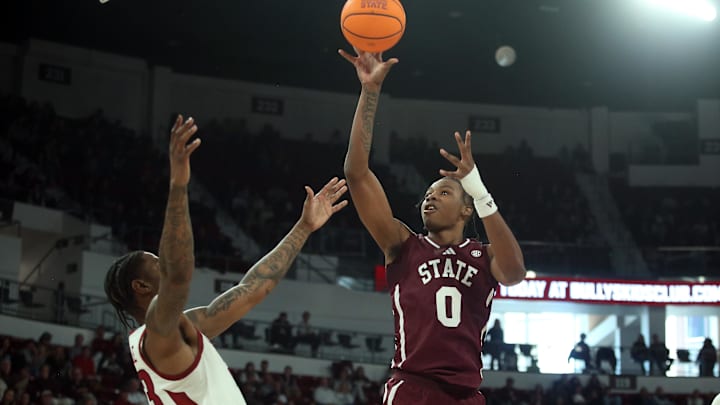 Feb 7, 2026; Starkville, Mississippi, USA; Mississippi State Bulldogs forward Jamarion Davis-Fleming (0) shoots over Arkansas Razorbacks forward Nick Pringle (23) during the second half at Humphrey Coliseum. Mandatory Credit: Petre Thomas-Imagn Images