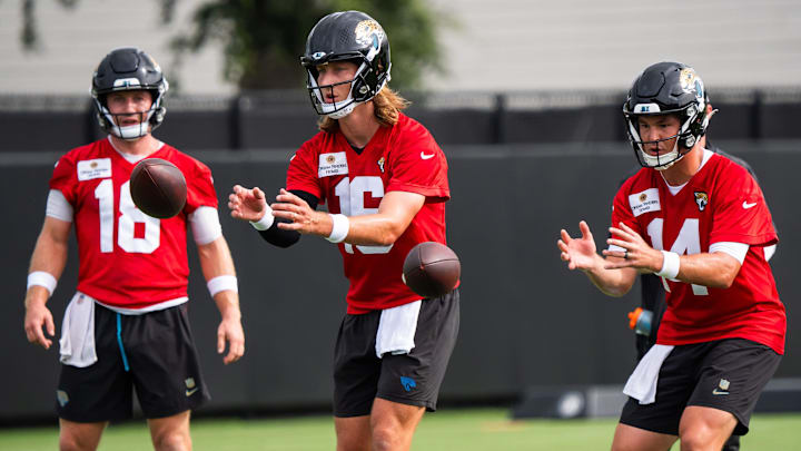 Jacksonville Jaguars quarterback John Wolford (18) watches as Jacksonville Jaguars quarterback Trevor Lawrence (16) and Jacksonville Jaguars quarterback Nick Mullens (14) take a snaps during the Jacksonville Jaguars’ mandatory minicamp Tuesday June 10, 2025 at the Miller Electric Center in Jacksonville, Fla. [Doug Engle/Florida Times-Union]