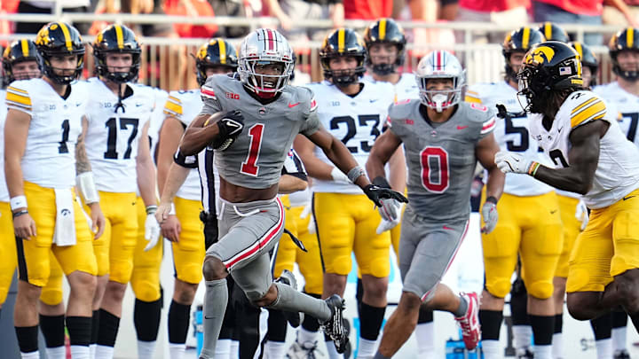 Ohio State cornerback Davison Igbinosun returns an interception against Iowa.