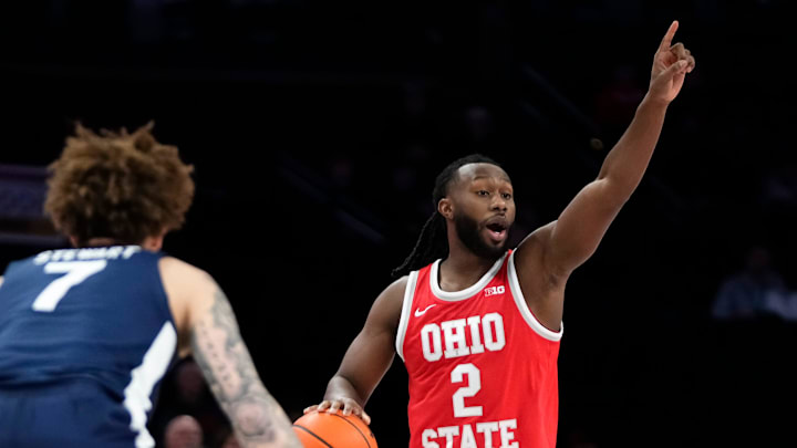 Ohio State Buckeyes guard Bruce Thornton (2) motions over Penn State Nittany Lions guard Dominick Stewart (7) during the first half of the NCAA men's basketball game at the Schottenstein Center in Columbus on Jan. 26, 2026. Ohio State Buckeyes guard Bruce Thornton (2) motions over Penn State Nittany Lions guard Dominick Stewart (7) during the first half of the NCAA men's basketball game at the Schottenstein Center in Columbus on Jan. 26, 2026.