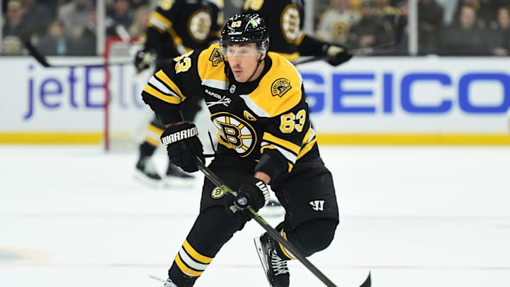 Feb 27, 2025; Boston, Massachusetts, USA; Boston Bruins left wing Brad Marchand (63) skates with the puck during the third period against the New York Islanders at TD Garden. Mandatory Credit: Bob DeChiara-Imagn Images