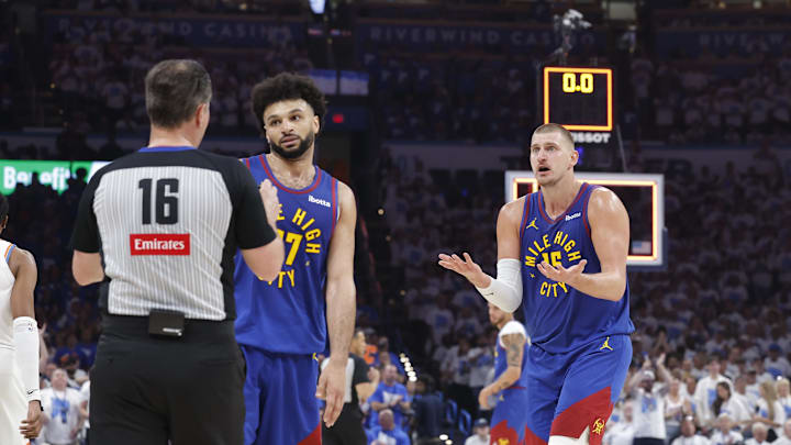 May 13, 2025; Oklahoma City, Oklahoma, USA; Denver Nuggets guard Jamal Murray (27) and center Nikola Jokic (15) react to an official's call after a play against the Oklahoma City Thunder during the second quarter of game five of the second round for the 2025 NBA Playoffs at Paycom Center. Mandatory Credit: Alonzo Adams-Imagn Images