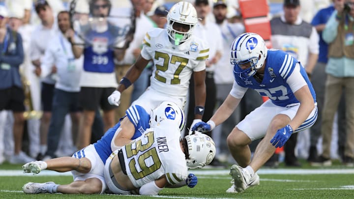 Dec 27, 2025; Orlando, FL, USA; Georgia Tech Yellow Jackets defensive back Will Kiker (39) recovers a fumble against the BYU Cougars in the second quarter during the Pop-Tarts Bowl at Camping World Stadium. Mandatory Credit: Nathan Ray Seebeck-Imagn Images Dec 27, 2025; Orlando, FL, USA; Georgia Tech Yellow Jackets defensive back Will Kiker (39) recovers a fumble against the BYU Cougars in the second quarter during the Pop-Tarts Bowl at Camping World Stadium. Mandatory Credit: Nathan Ray Seebeck-Imagn Images