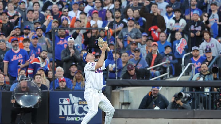 New York Mets first base Pete Alonso (20) makes a catch for against the New York Mets out in the second inning against the Los Angeles Dodgers during game five of the NLCS for the 2024 MLB playoffs at Citi Field. 