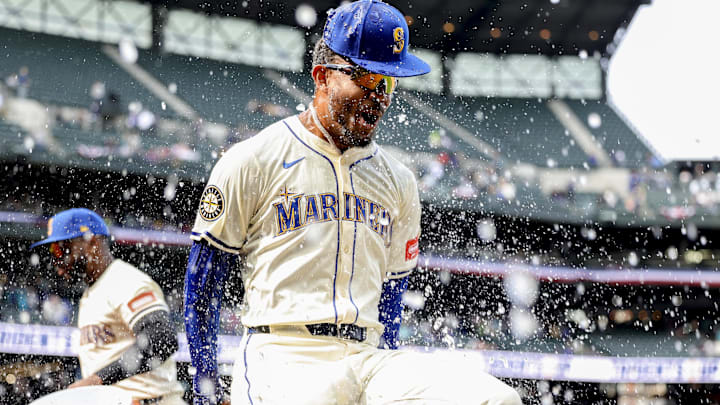 Seattle Mariners center fielder Julio Rodríguez reacts after having water dumped on him after a go-ahead home run against the Athletics on March 30 at T-Mobile Park.