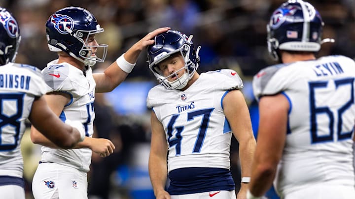 Aug 25, 2024; New Orleans, Louisiana, USA;  Tennessee Titans punter Ty Zentner (17) pats the helmet of place kicker Brayden Narveson (47) after he made a field goal against the New Orleans Saints during the second half at Caesars Superdome.