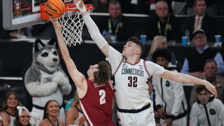 Apr 6, 2024; Glendale, AZ, USA; Alabama Crimson Tide forward Grant Nelson (2) shoots against Connecticut Huskies center Donovan Clingan (32)  in the semifinals of the men's Final Four of the 2024 NCAA Tournament at State Farm Stadium. Mandatory Credit: Joe Rondone/Arizona Republic-USA TODAY Sports