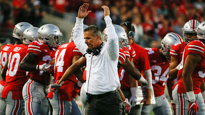 Ohio State Buckeyes head coach Urban Meyer pumps his arms as the Buckeyes take the field before a NCAA college football game between the Ohio State Buckeyes and the Oklahoma Sooners on Saturday, September 9, 2017 at Ohio Stadium in Columbus, Ohio. [Joshua A. Bickel/Dispatch]