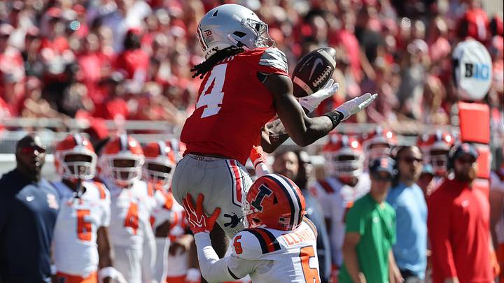 Sep 26, 2026; Columbus, Ohio, USA; Ohio State Buckeyes wide receiver Jeremiah Smith (4) makes a catch as Illinois Fighting Illini defensive back Juice Clarke (6) defends during the second half at Ohio Stadium. Mandatory Credit: Joseph Maiorana-Imagn Images Sep 26, 2026; Columbus, Ohio, USA; Ohio State Buckeyes wide receiver Jeremiah Smith (4) makes a catch as Illinois Fighting Illini defensive back Juice Clarke (6) defends during the second half at Ohio Stadium. Mandatory Credit: Joseph Maiorana-Imagn Images