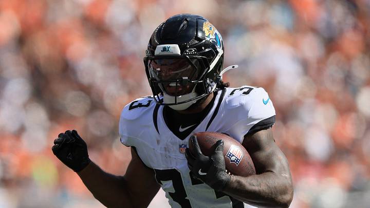 Oct 4, 2026; Cincinnati, Ohio, USA;  Jacksonville Jaguars running back Bhayshul Tuten (33) runs with the ball during the second quarter against the Cincinnati Bengals at Paycor Stadium.  Mandatory Credit: Katie Stratman-Imagn Images